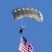 Parachutists deliver American flag for Rodeo opening ceremony