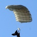 Parachutists deliver American flag for Rodeo opening ceremony