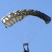 Parachutists deliver American flag for Rodeo opening ceremony