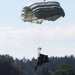 Parachutists deliver American flag for Rodeo opening ceremony