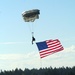 Parachutists deliver American flag for Rodeo opening ceremony