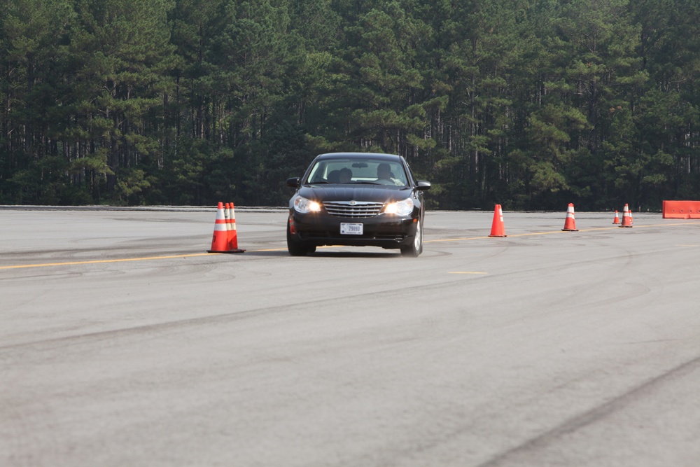 Military, civilian police officers whip through emergency vehicle operators’ training