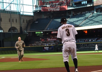 National Guard officer honored with first pitch