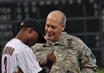 National Guard officer honored with first pitch