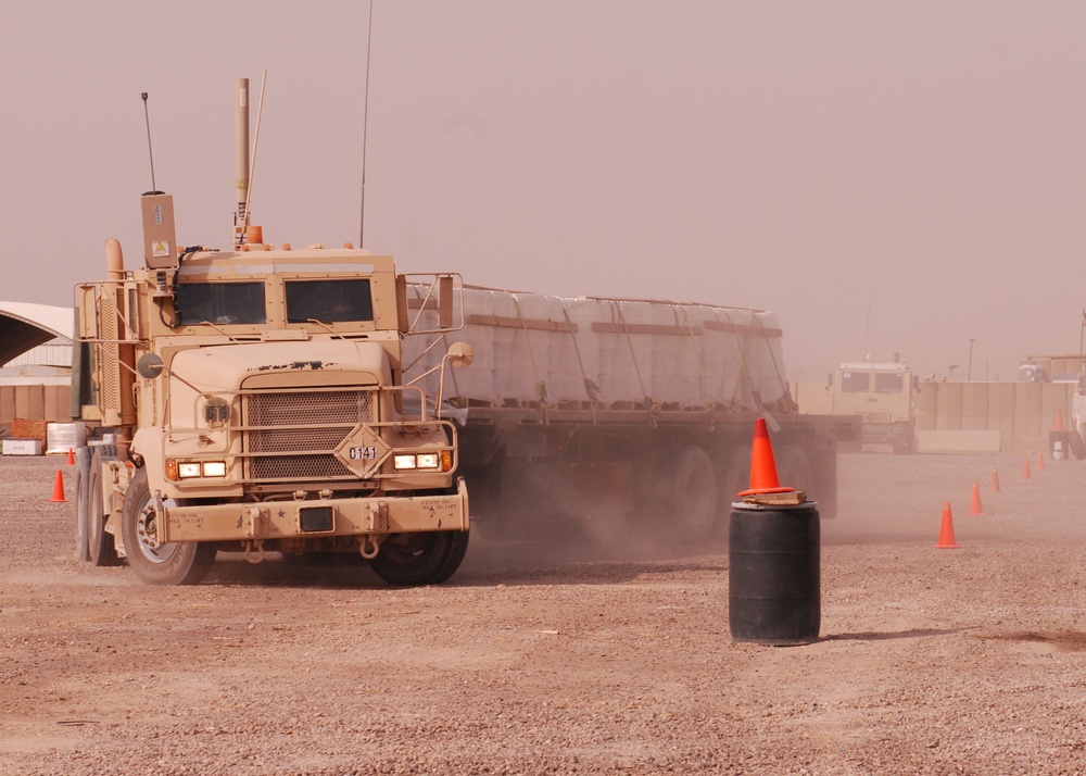 215th BSB puts on heavy metal rodeo: 1st Cavalry soldiers navigate vehicles through obstacle course