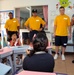 Sailors help children