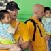 Sailors help children