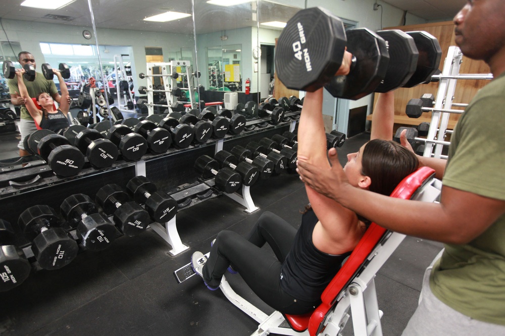 Marine builds strength with weightlifting