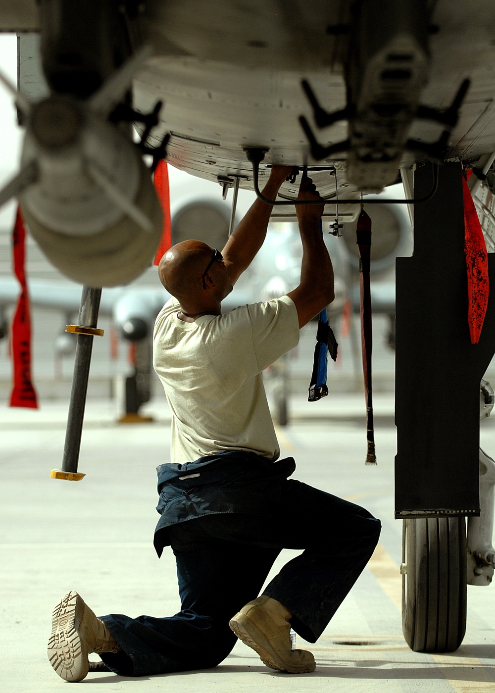 Airmen deployed to Afghanistan load ammo onto A-10’s for missions