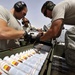 Airmen deployed to Afghanistan load ammo onto A-10’s for missions