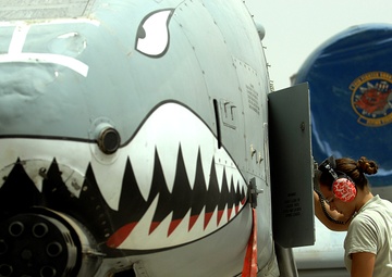 Airmen deployed to Afghanistan load ammo onto A-10’s for missions