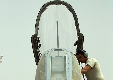 Airmen deployed to Afghanistan load ammo onto A-10’s for missions