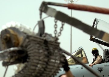 Airmen deployed to Afghanistan load ammo onto A-10’s for missions