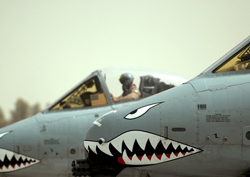 Airmen deployed to Afghanistan load ammo onto A-10’s for missions
