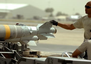 Airmen deployed to Afghanistan load ammo onto A-10’s for missions