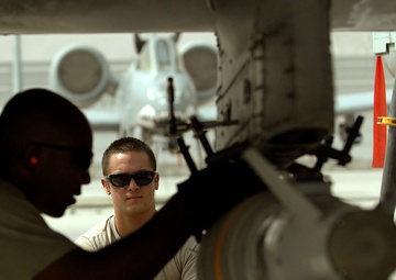 Airmen deployed to Afghanistan load ammo onto A-10’s for missions