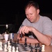 Capt. Tyler Carruth, medical provider with the Texas Medical Command, plays chess at Contingency Operating Base Basra. During his deployment to Iraq, Carruth was responsible for testing a blue-tooth enabled electrocardiogram for Black Hawk helicopters. (P