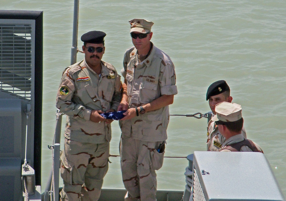 Flag exchange during Swift boat turnover ceremony