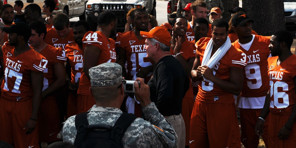 University of Texas football players and coaches show appreciation to Texas Guardsmen