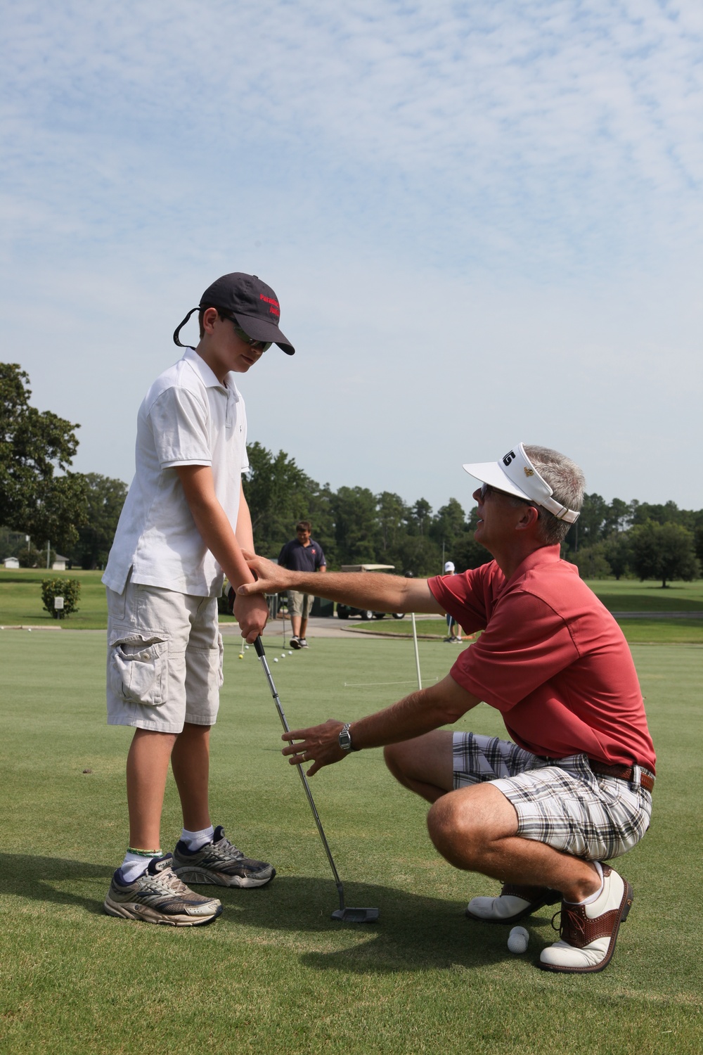 Paradise Point training future golf players during three day golf clinic