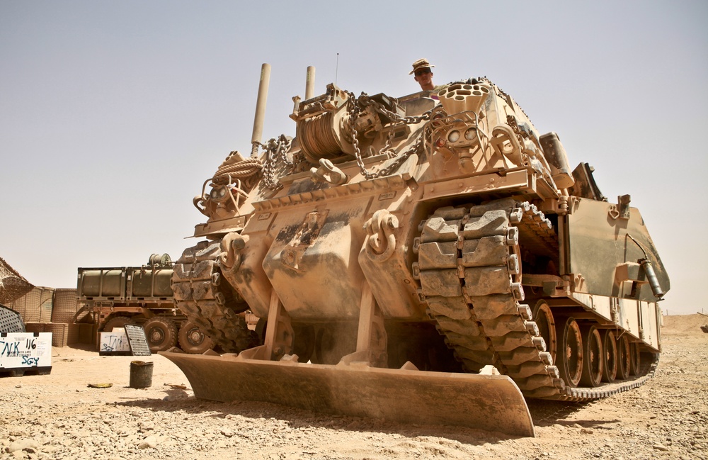 Alpha Company tank mechanics maintain 70–ton armored beasts