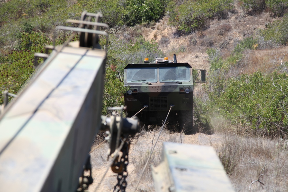 Chain gang: Wreckers train to recover vehicles in desert terrain