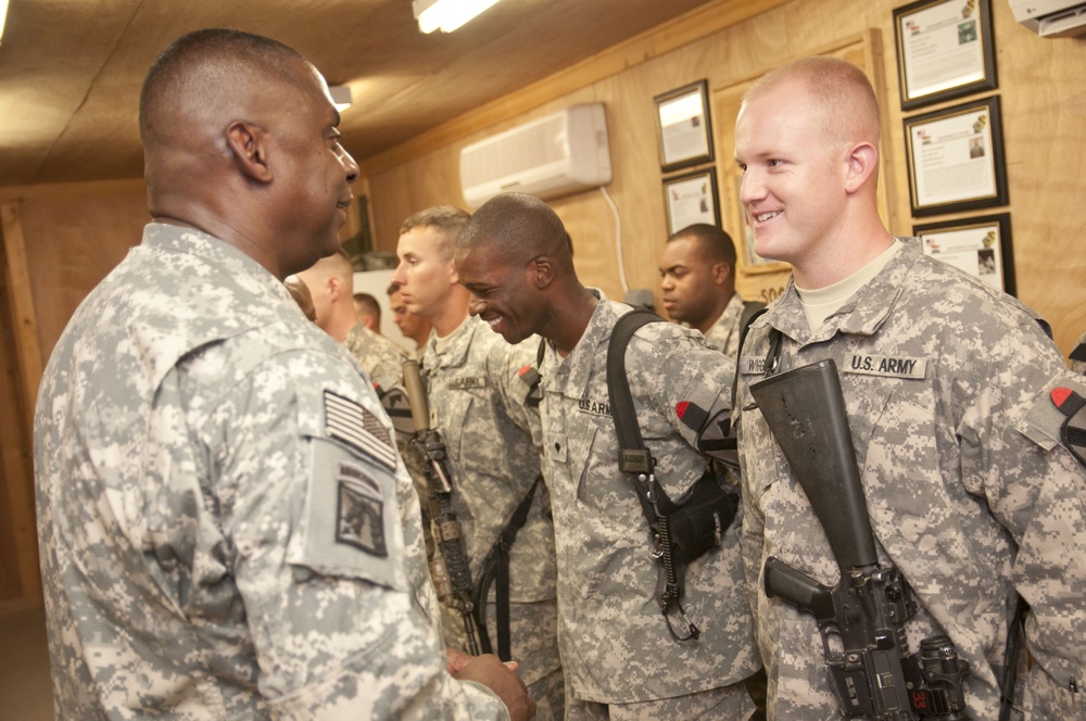 Gen. Austin presents coins to outstanding soldiers on COB Delta