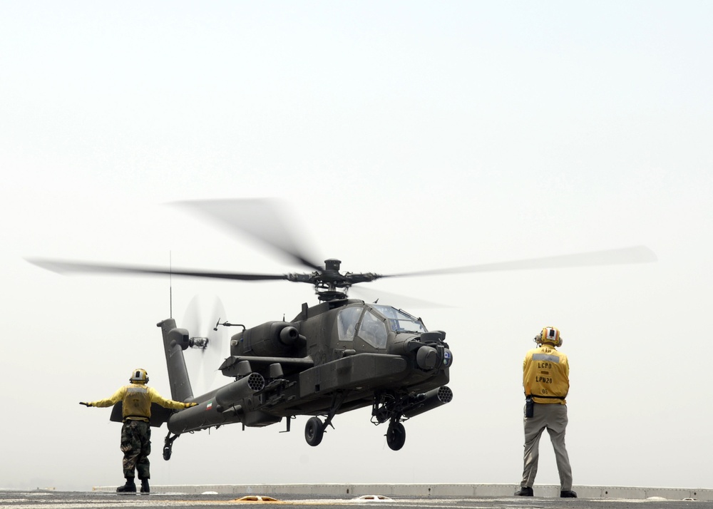 USS Green Bay sailor signals Apache landing