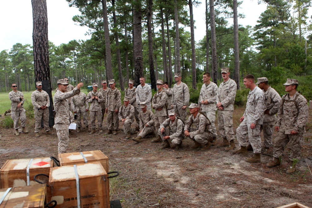 Mortarmen launch rounds down range