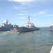 The Arleigh Burke-class guided-missile destroyer USS Mahan (DDG 72) departs Naval Station Norfolk underway in advance of Hurricane Irene