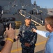 The Arleigh Burke-class guided-missile destroyer USS Mason (DDG 87) commanding officer, Cmdr. Adan Cruz speaks to media prior to departing Naval Station Norfolk in advance of Hurricane Irene