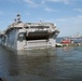 The amphibious assault ship USS Wasp (LHD 1) departs Naval Station Norfolk in advance of Hurricane Irene