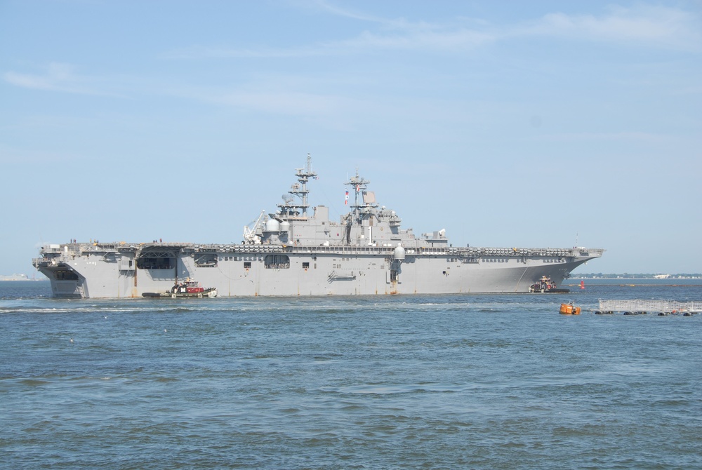 The amphibious assault ship USS Wasp (LHD 1) departs Naval Station Norfolk in advance of Hurricane Irene.