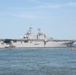 The amphibious assault ship USS Wasp (LHD 1) departs Naval Station Norfolk in advance of Hurricane Irene.