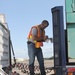 FEMA worker inspects vehicle