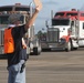 FEMA worker directs relief supply vehicles