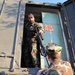 Seabee issuing a grenade launcher