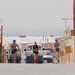 Bicyclists escort runner during Hood to Coast Satellite Run in Afghanistan