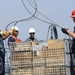 Sailors offload pallet aboard USS Blue Ridge