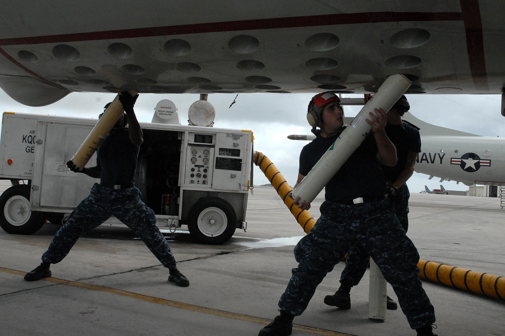 Sailors load P-3C Orion sonobuoys