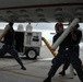 Sailors load P-3C Orion sonobuoys