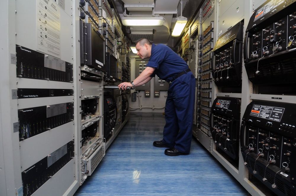 USS George H.W. Bush sailor inside ultra high frequency work center