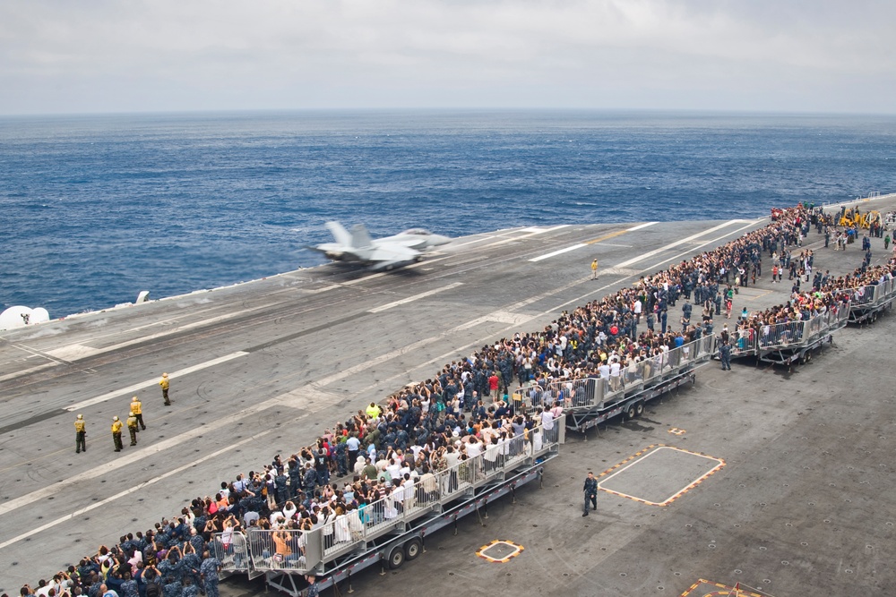 USS George Washington sailors and their families observe flight launch