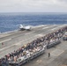 USS George Washington sailors and their families observe flight launch