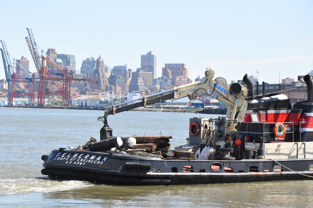 Army corps drift collection crews work to clear potential hazards to navigation from the harbor after Irene