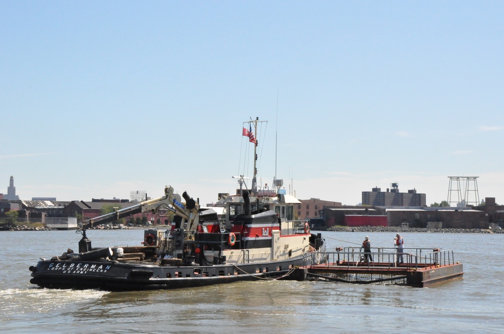 Army corps drift collection crews work to clear potential hazards to navigation from the harbor after Irene