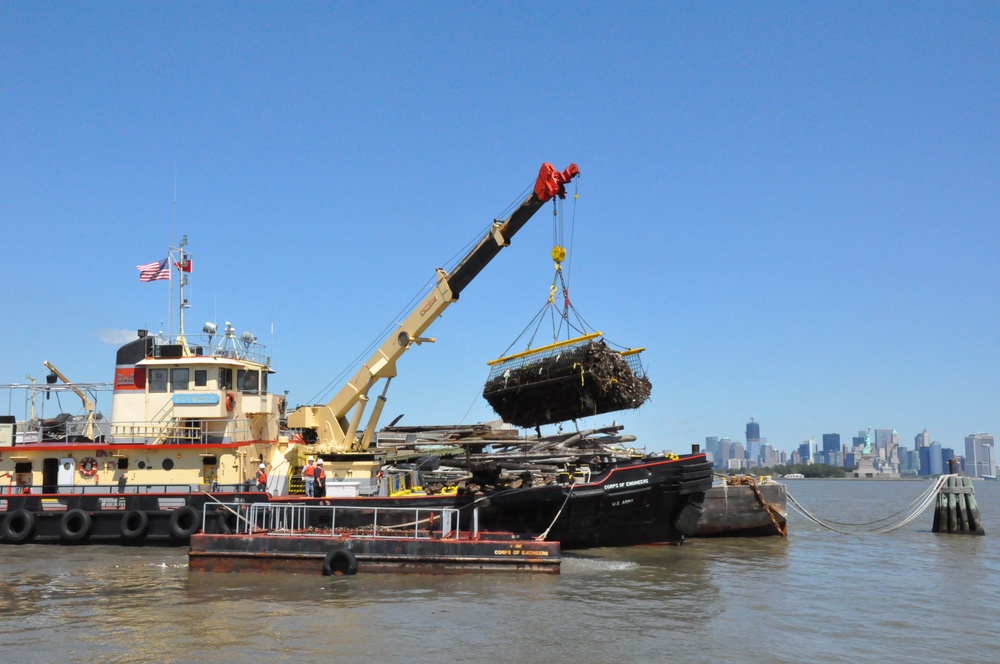 Army Corps drift collection crews work to clear potential hazards to navigation from the harbor after Irene