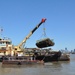 Army Corps drift collection crews work to clear potential hazards to navigation from the harbor after Irene