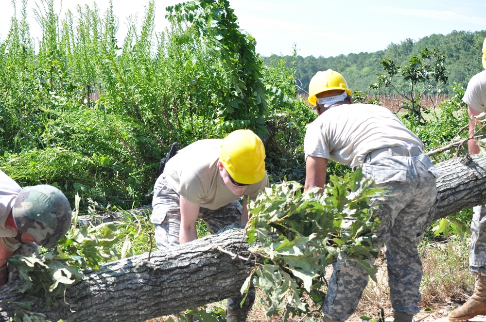 Virginia National Guard soldiers clear fallen trees