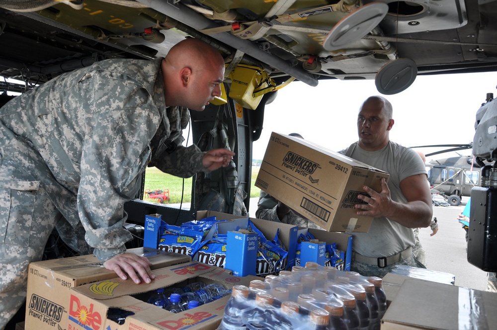New York Army National Guard helicopters fly supplies to flood-hit towns